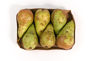 Pears on a white background, pears on a paper tray, a fruit full of vitamins, healthy and juicy