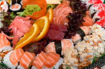 Woman hand holding chopsticks. Takeaway sushi lunchbox. Sushi maki roll filled with a variety of fresh ingredients, a lively assortment of fresh sushi, including nigiri, rolls, and sashimi, beautifull © Anna Kondratiuk