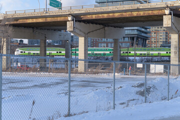 Obraz premium view of elevated Gardiner Expressway and Go Train heading westbound into the downtown core from Cherry St, Toronto