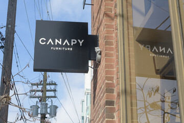 Naklejka premium square projecting sign outside Canapy Furniture located at 326 Davenport Rd, Toronto