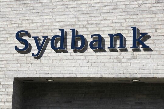 Svendborg, Denmark - August 13, 2020: Sydbank logo on a wall. Sydbank is one of Denmark's largest full service banks headquartered in Aabenraa