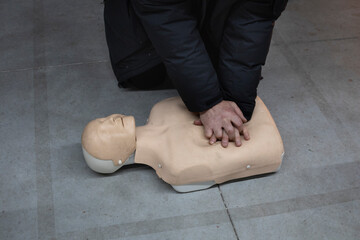 Cardiopulmonary resuscitation (CPR) training course using a mannequin. Emergency techniques, first aid