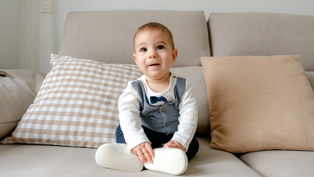 Adorable baby dressed for a wedding celebration
