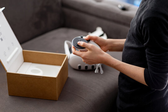 Teen Boy Holding Virtual Reality Controller at Home Setting