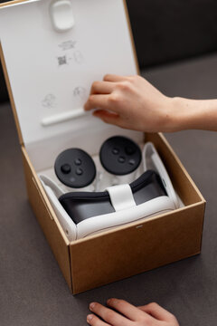 Teen Boy Unboxing Virtual Reality Headset at Home Setting