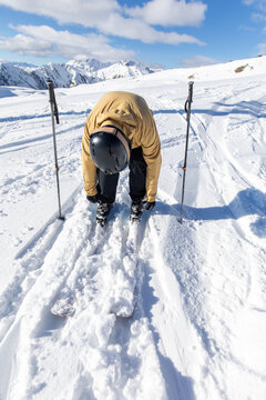 Man preparing skis in the Pyrenean mountains