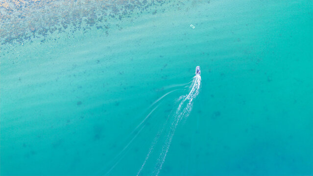 Serene aerial view of boat navigating Lofoten waters