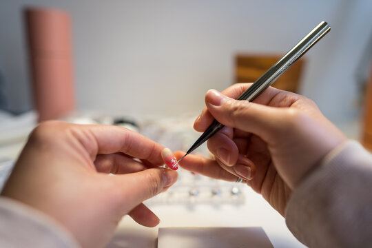 Delicate nail art in a home setting