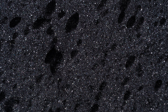 Abstract dark sponge foam texture surface