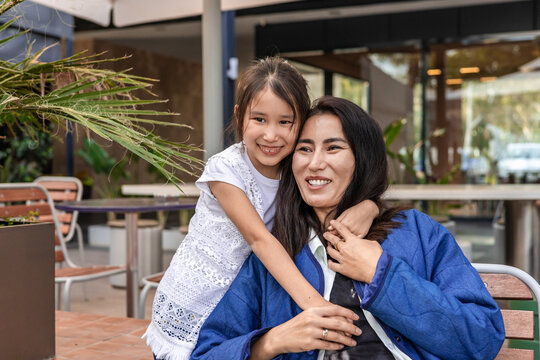 Mother and daughter enjoying time at a cafe