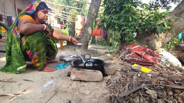 Rural Indian Woman Cooking Outdoors in Traditional Village Kitchen, Preparing Food on Wood Fire Chulha, Authentic Indian Lifestyle, Culture and Rural Life