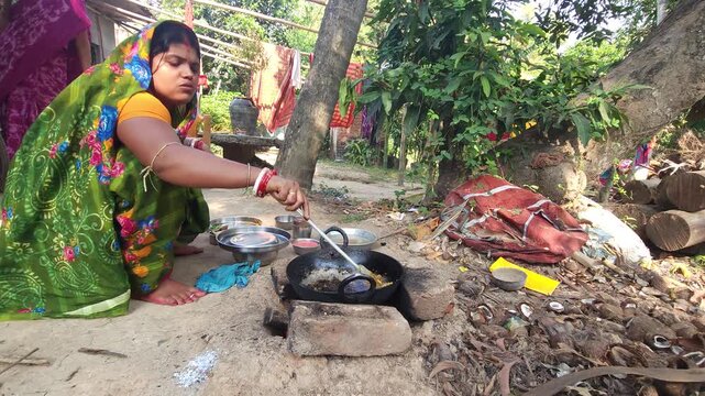 Rural Indian Woman Cooking Outdoors in Traditional Village Kitchen, Preparing Food on Wood Fire Chulha, Authentic Indian Lifestyle, Culture and Rural Life