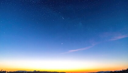 Fototapeta premium Vast Blue Sky at Dusk with Faint Stars and Horizon Glow.
