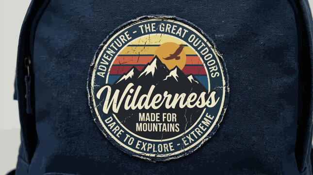 Retro Wilderness Adventure Patch Mockup on Dark Canvas Backpack. Vintage Grunge T-Shirt Graphic Design for Hiking and The Great Outdoors Concept.