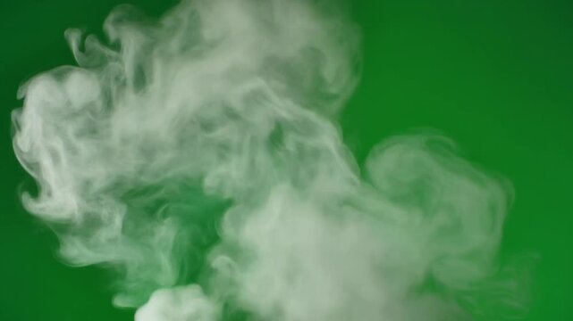 Soft white smoke puff on green screen background overlay