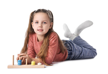 Cute little girl playing with stacking and counting game on white background