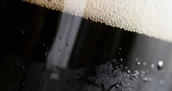 AI close-up of freshly poured dark beer in a chilled glass, symbolizing the craft, passion, and authenticity of local microbreweries&mdash;rich foam, slow pour, and artisan brewing culture.