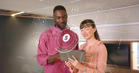 Reviewing financial HUD, colleagues wearing magenta shirt and peach blouse using tablet in office
