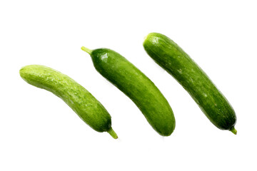 Fresh mini baby cucumbers on white background