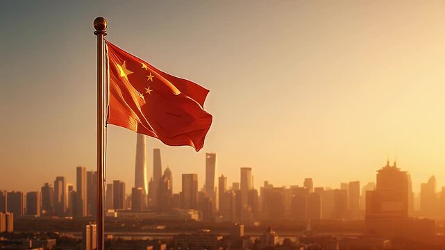 Chinese flag waving during golden sunset over city skyline