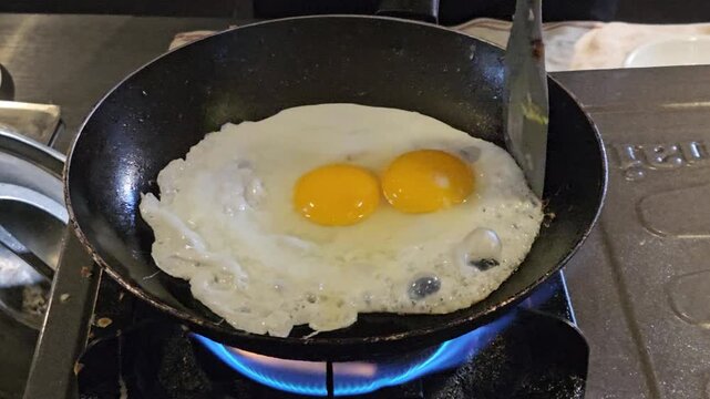 This is a sunny-side-up egg at pan