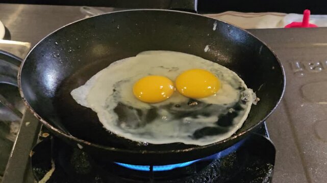 This is a sunny-side-up egg at pan