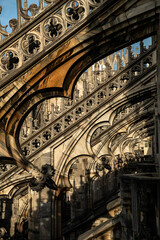Gothic Stonework and Flying Buttresses on Duomo Rooftop, Milan, Italy