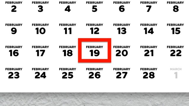 Close-up of the date February 19th marked with a red cursor on the wall calendar 2026