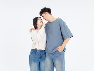 Fototapeta premium Portrait asian cute young couple love happy cheerful smile posing embracing in casual clothes hugging on white background studio together relationship good time sweet enjoy moment beautiful romantic.