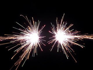 Fototapeta premium Action-reaction pair illustrated by opposing, mirrored bursts of light energy, perfectly balanced, abstract, action