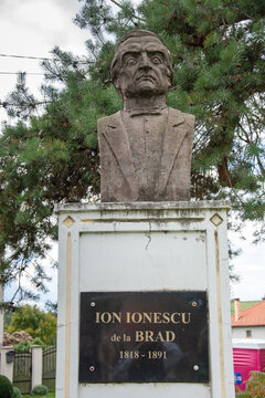 a bust sculpture of Ion Ionescu de la Brad, located in Batos, Mures, Romania 2022, a prominent Romanian agronomist, revolutionary, and professor.