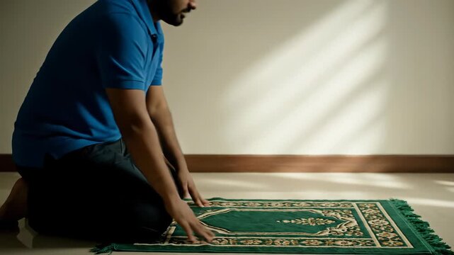 Man Praying on Carpet in Serene Room.