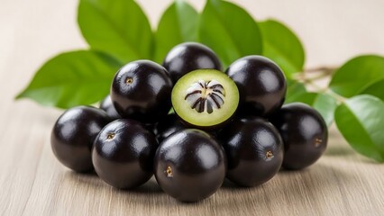 Fresh jambu fruit with green leaves.