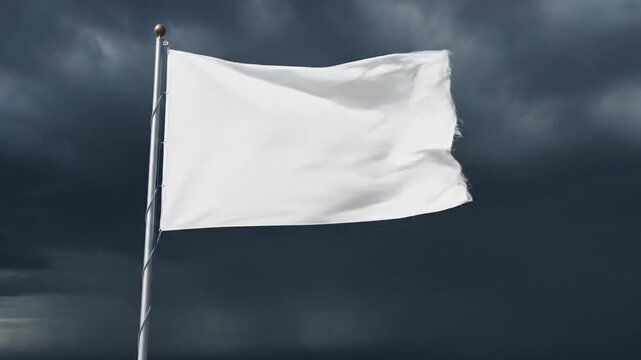 White flag waving against stormy dark clouds symbolizing surrender or peace