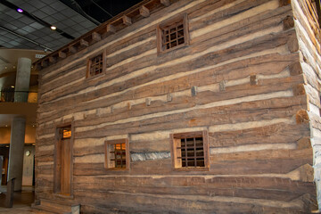 Side view of the two-story log slave pen built in 1830 in Germantown, KY and reconstructed in the National Underground Railroad Freedom Center.
