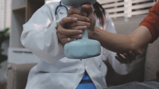 Dumbbells, physical therapy and old man with physiotherapist, muscle training and strength with senior care. Health, wellness and men at physio clinic for weightlifting, rehabilitation and equipment