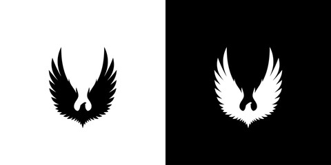 Obraz premium A graphic illustration of two wing silhouettes in black and white on contrasting