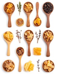 A collection of wooden spoons with various food items and herbs