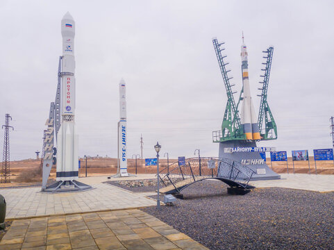 Outdoor rocket monuments at Baikonur Cosmodrome in Kazakhstan, Russian-leased spaceport, feature Soyuz and Proton full-scale models (public space).
