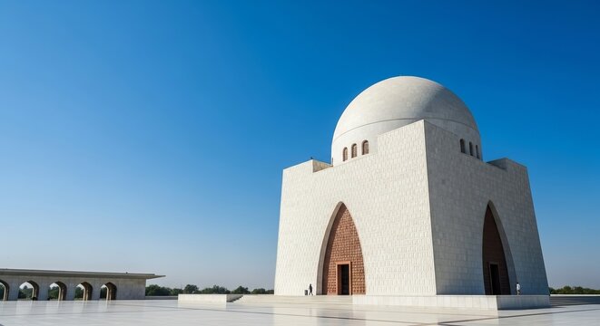The majestic Quaid-e-Azam Mausoleum, an iconic tomb with impressive architecture under a clear blue sky, reflecting a national heritage concept