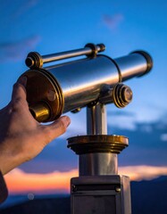 Hand Adjusts Antique Coin Operated Telescope at Dusk Over Distant Cityscape Silhouetted Hills Under Dramatic Sunset Sky with Warm Golden Light Illuminating Metal Optics