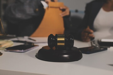 Obraz premium Businesswoman and Male lawyer or judge consult and conference having team meeting with client at law firm in office, Law and Legal services concept