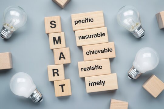 Smart goals concept with light bulbs on gray background