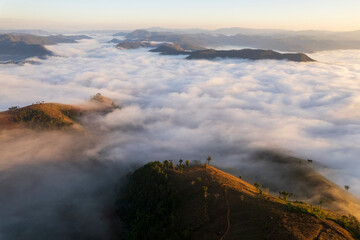 Landscape of Morning Mist with Mountain Layer. mountain ridge and clouds in rural jungle bush forest