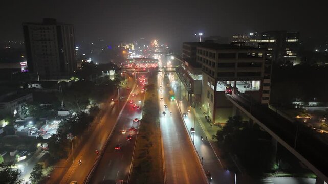 Shot of Traffic running on the road at night in Delhi, India
