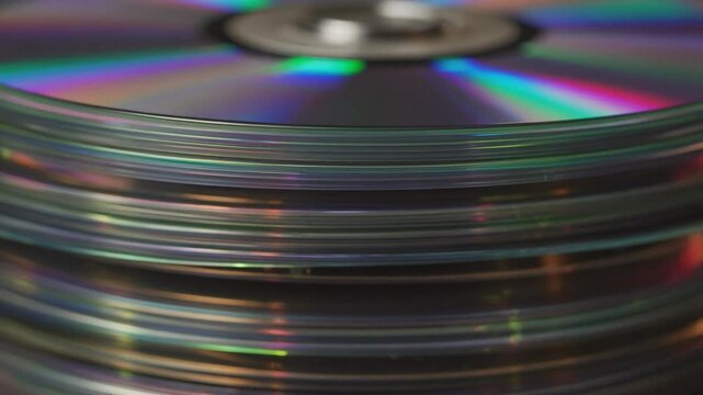 Stacks of Reflective CDs on a Dark Background, Storage Media Concept
