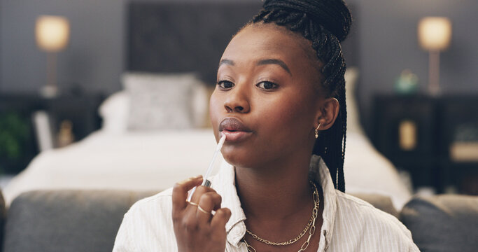 Black woman, makeup and lipstick in home, beauty or product with color, glow and self care. African person, morning routine and cosmetics with lip gloss, application and tools for mouth in house