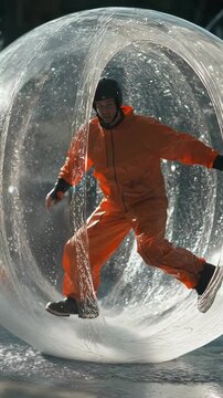 selective focus fun water zorbing activity with joyful person