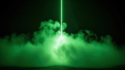 Dramatic green neon light beam cuts through swirling smoke and fog at night