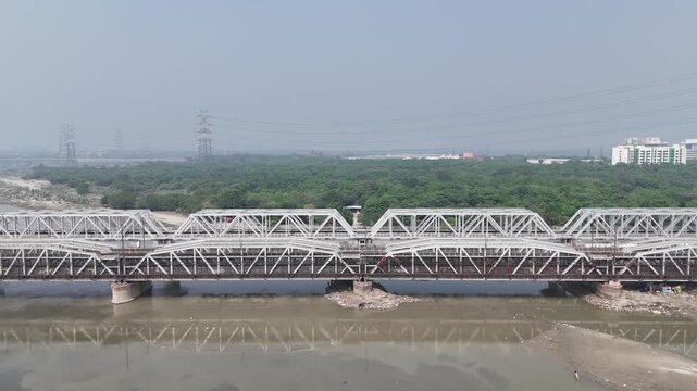 Aerial view of old iron bridge, Loha pul at Yamuna River in Delhi, India
